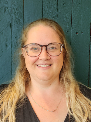 Claire smiling widely.